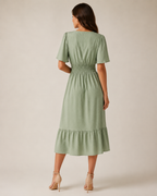Marjolijn - Midi-jurk met V-hals en Tailleaccent