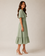 Marjolijn - Midi-jurk met V-hals en Tailleaccent